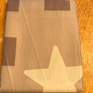 Shower curtain brown in color